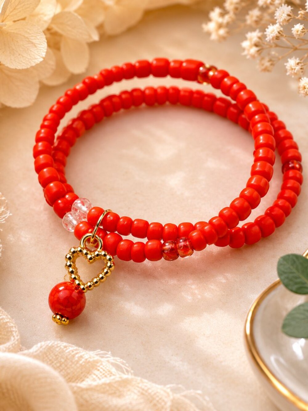 Orange Beaded Stretch Bracelet With Gold Tone Heart And Charm Accent